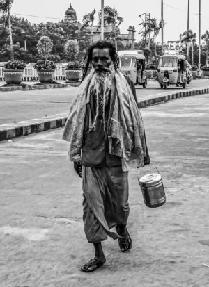 Sadhu walking on road
