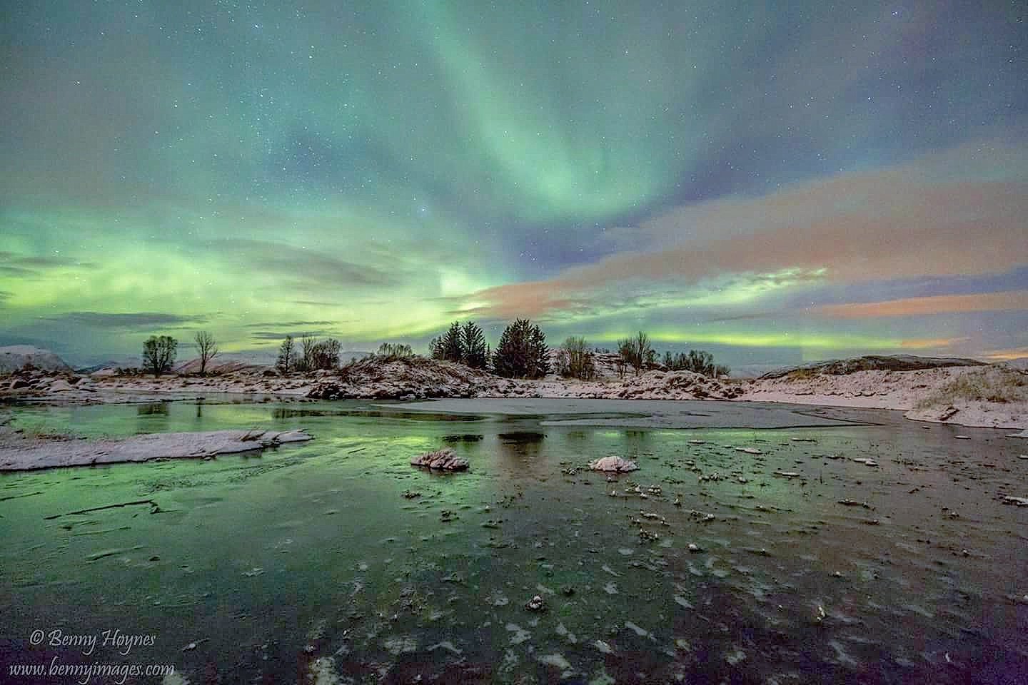 Aurora over a pond
